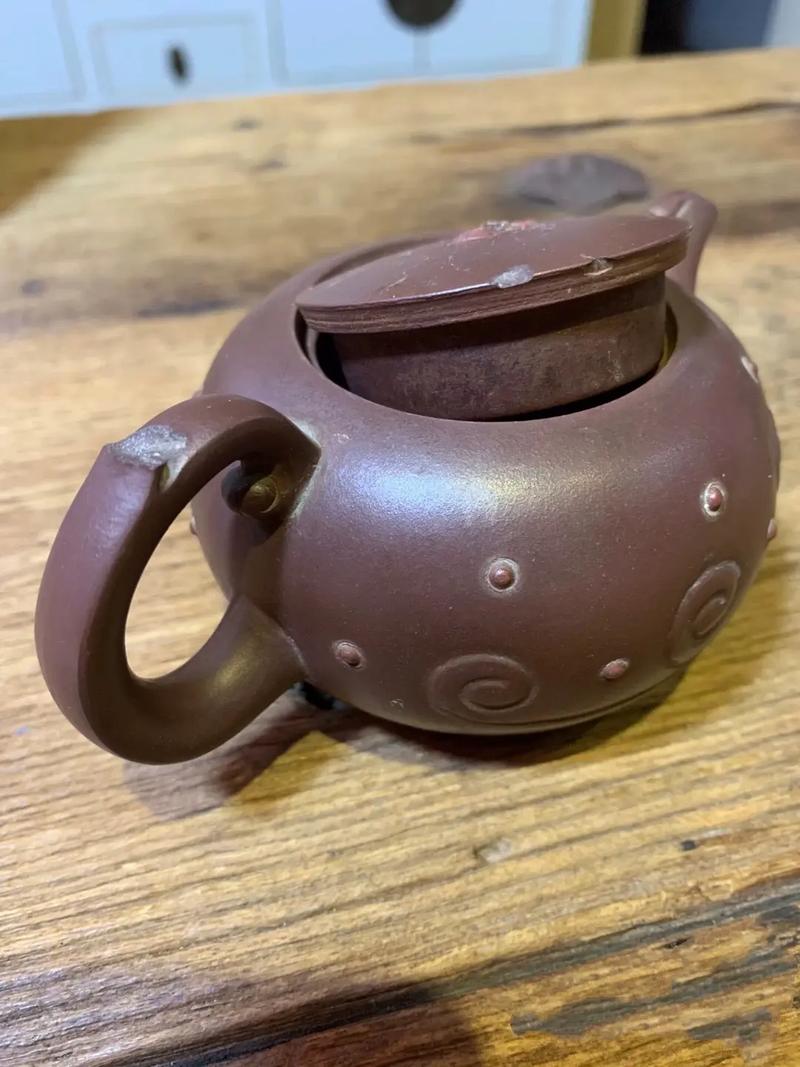 紫砂壶摸起来有点粘手